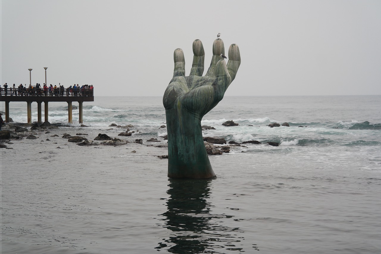 pohang hands statue beach free photo