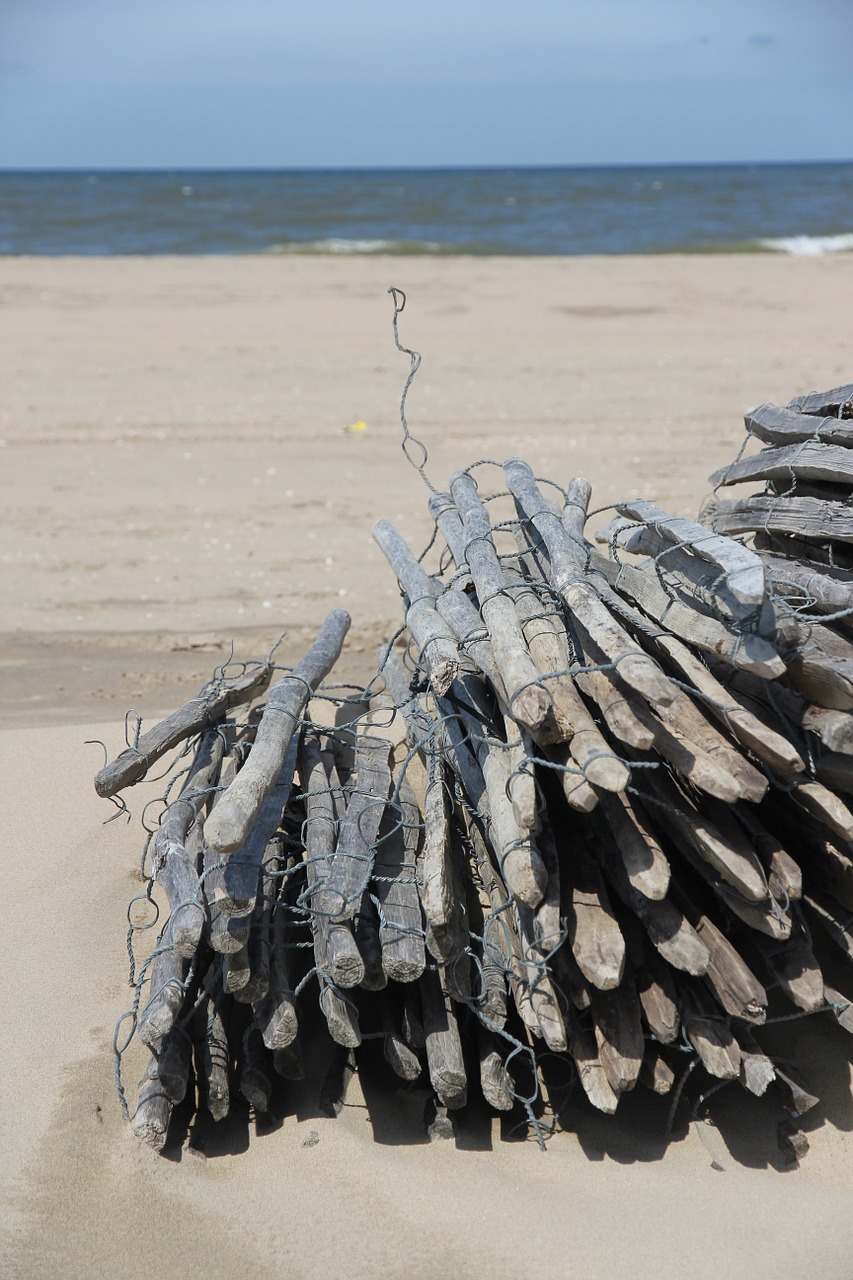 poles beach sea free photo