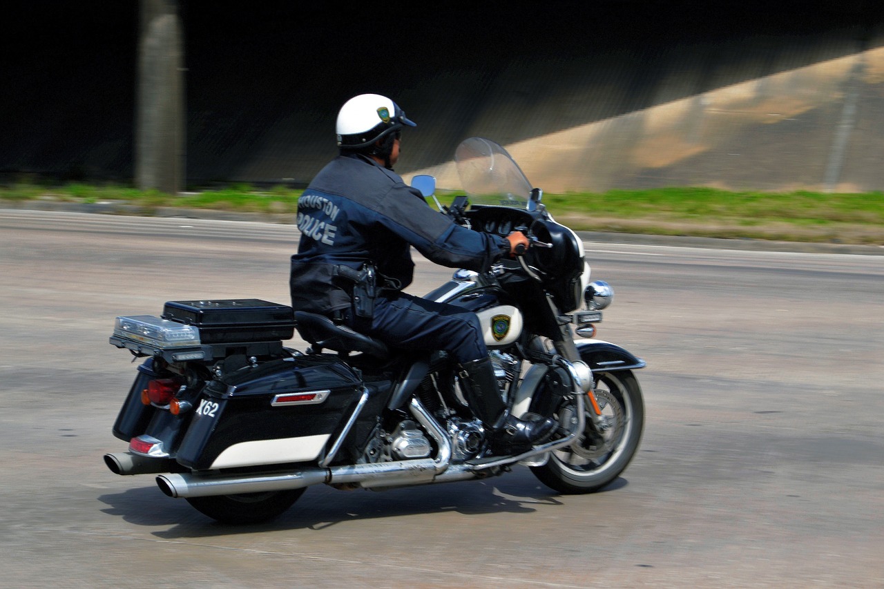 police officer motorcycle patrol free photo