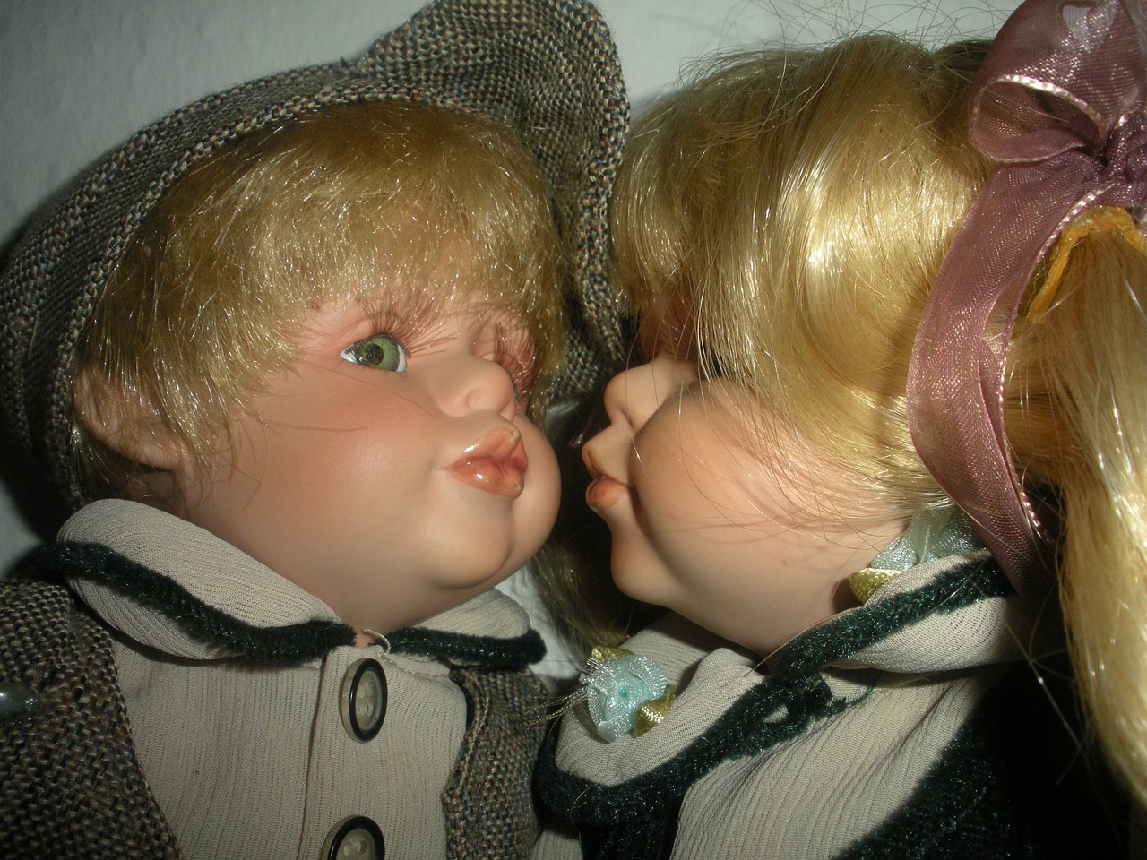 porcelain dolls kissing close-up free photo