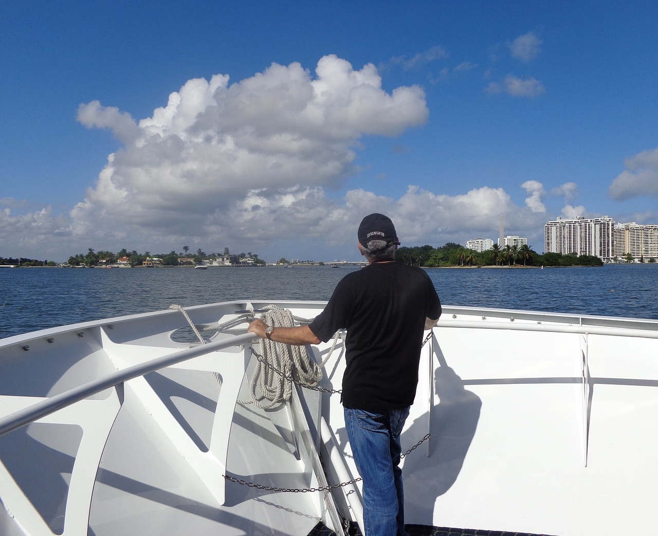 port of miami boat man watching free photo