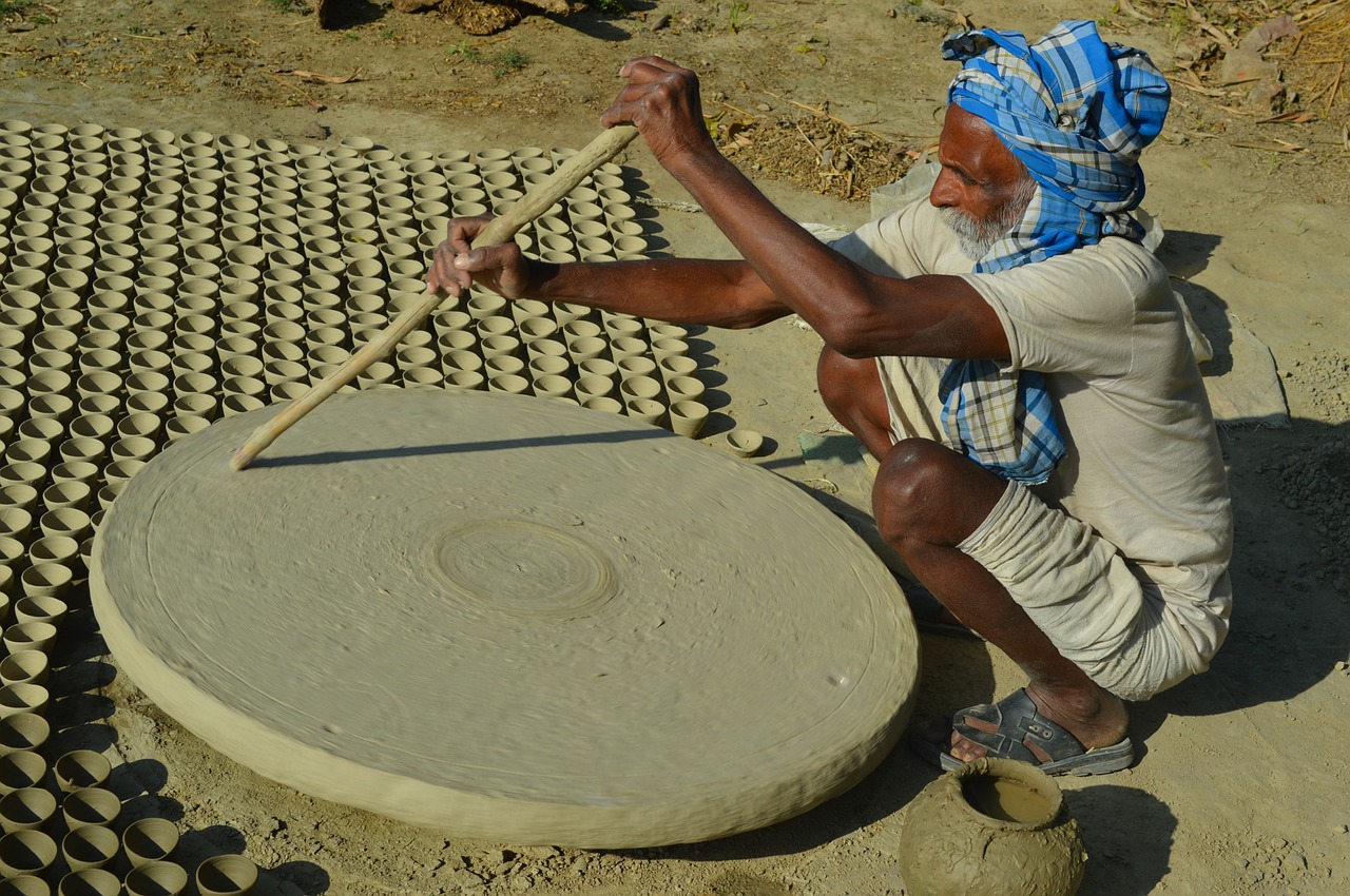 pottery old man working in village free photo