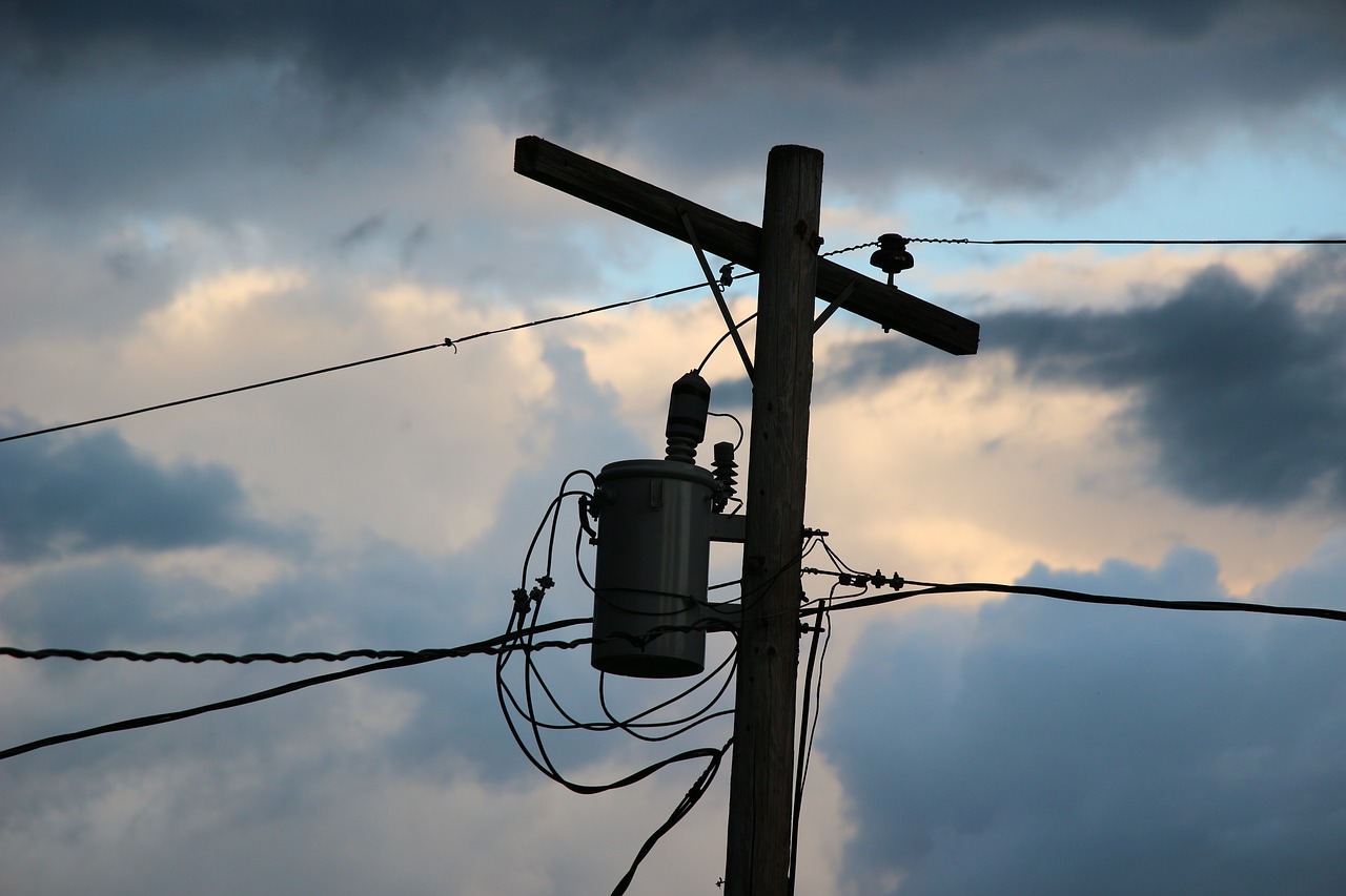 power pole  clouds  electricity free photo