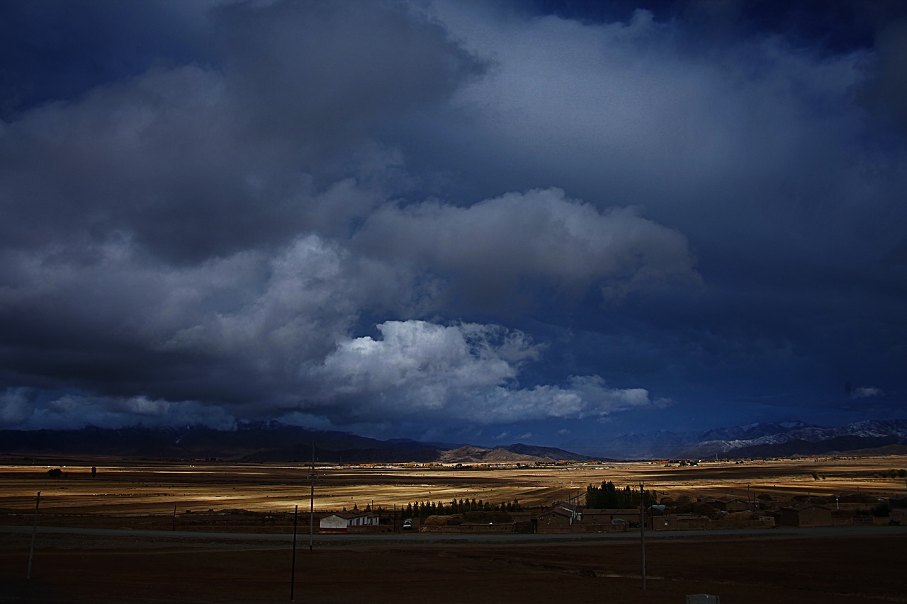 prairie  dark clouds  cloudy day free photo