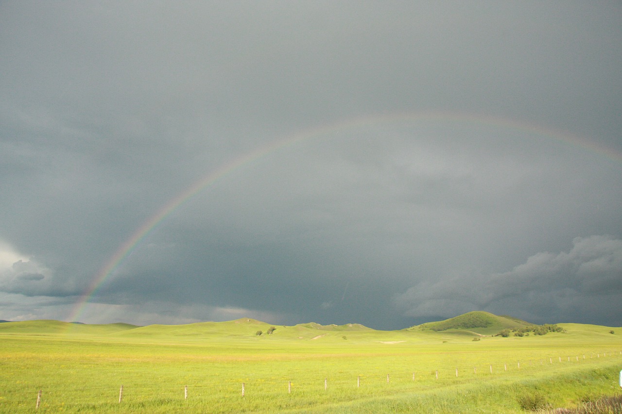 prairie rainbow rain cloudy day free photo