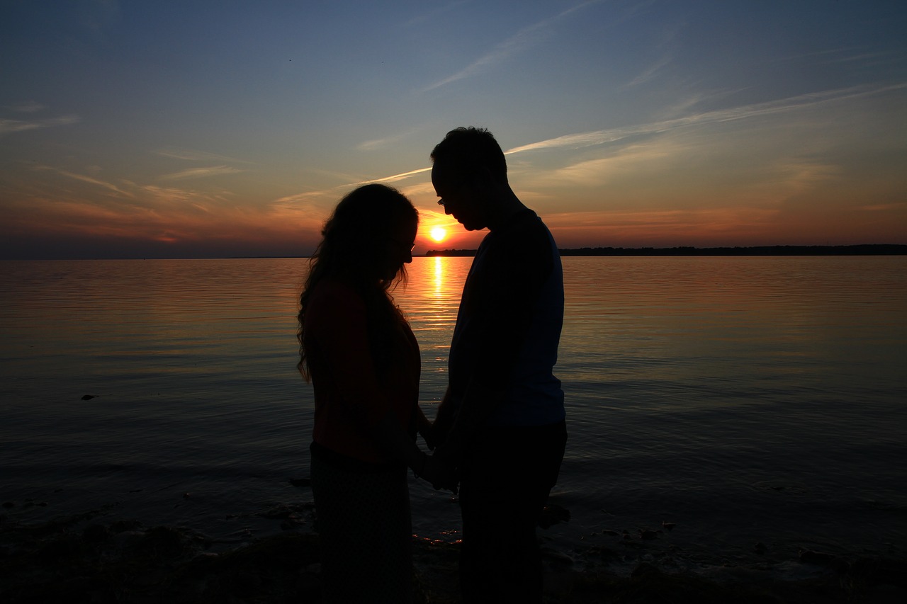 prayer  couple  sunset free photo