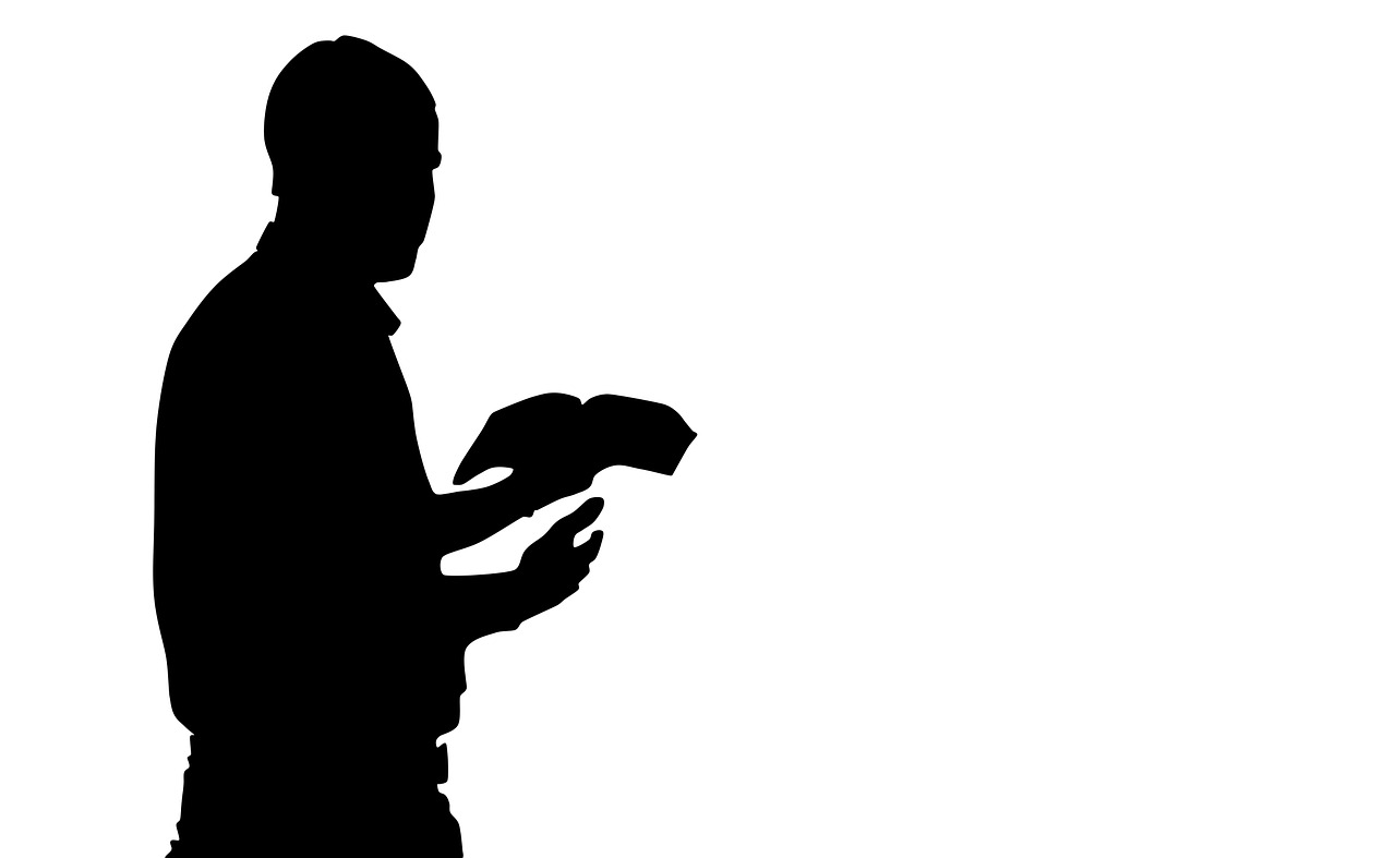 praying man man reading the bible silhouette free photo