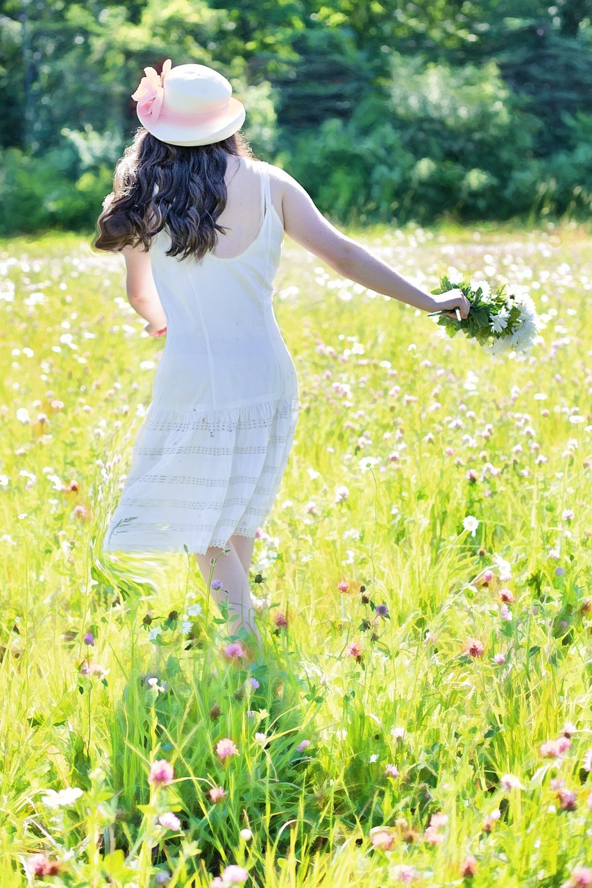pretty girl in wildflowers meadow summer free photo