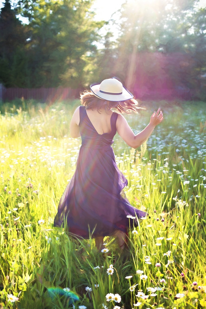 pretty woman in field dancing sunshine free photo