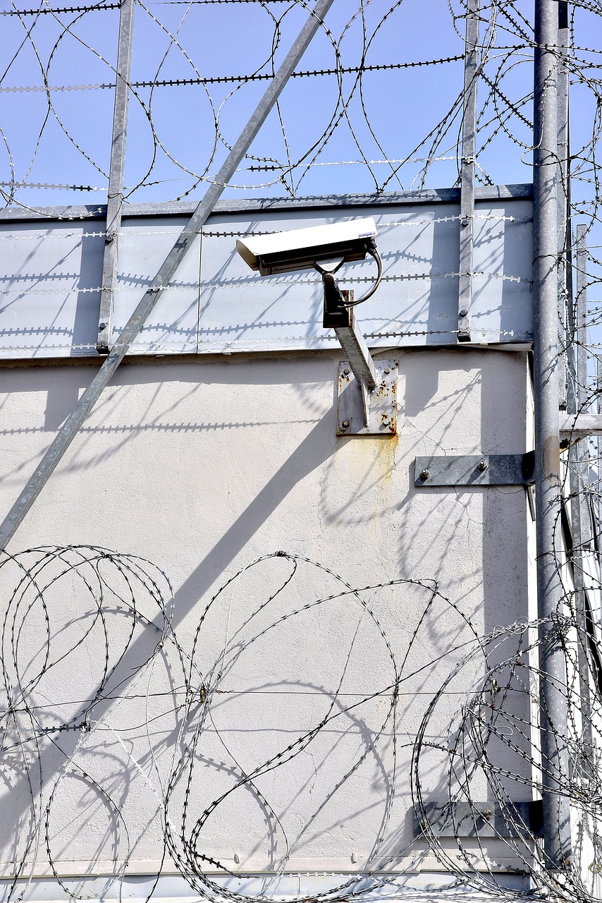 prison  barbed wire  camera free photo