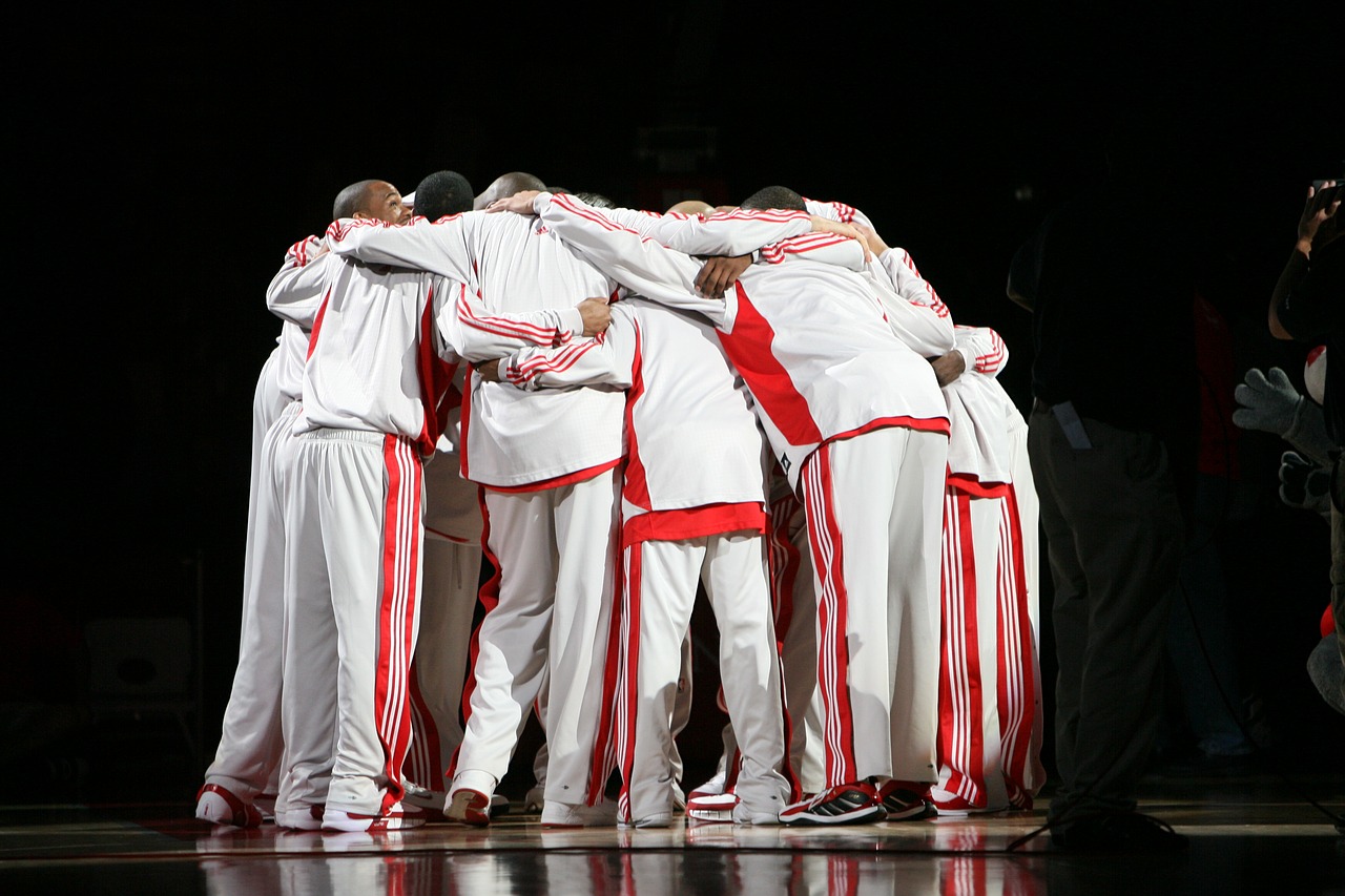 pro basketball team huddle basketball players free photo