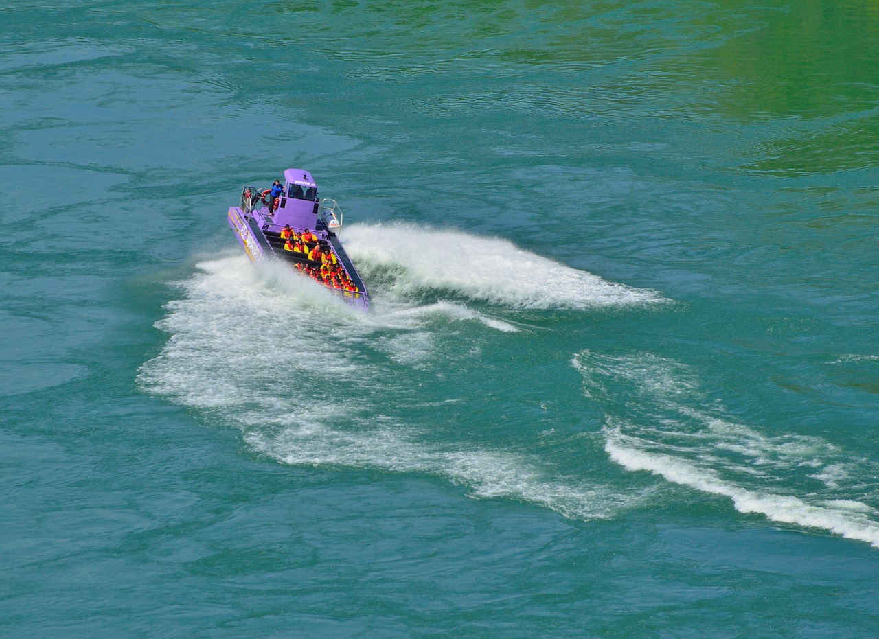purple jet boat spinning waves free photo