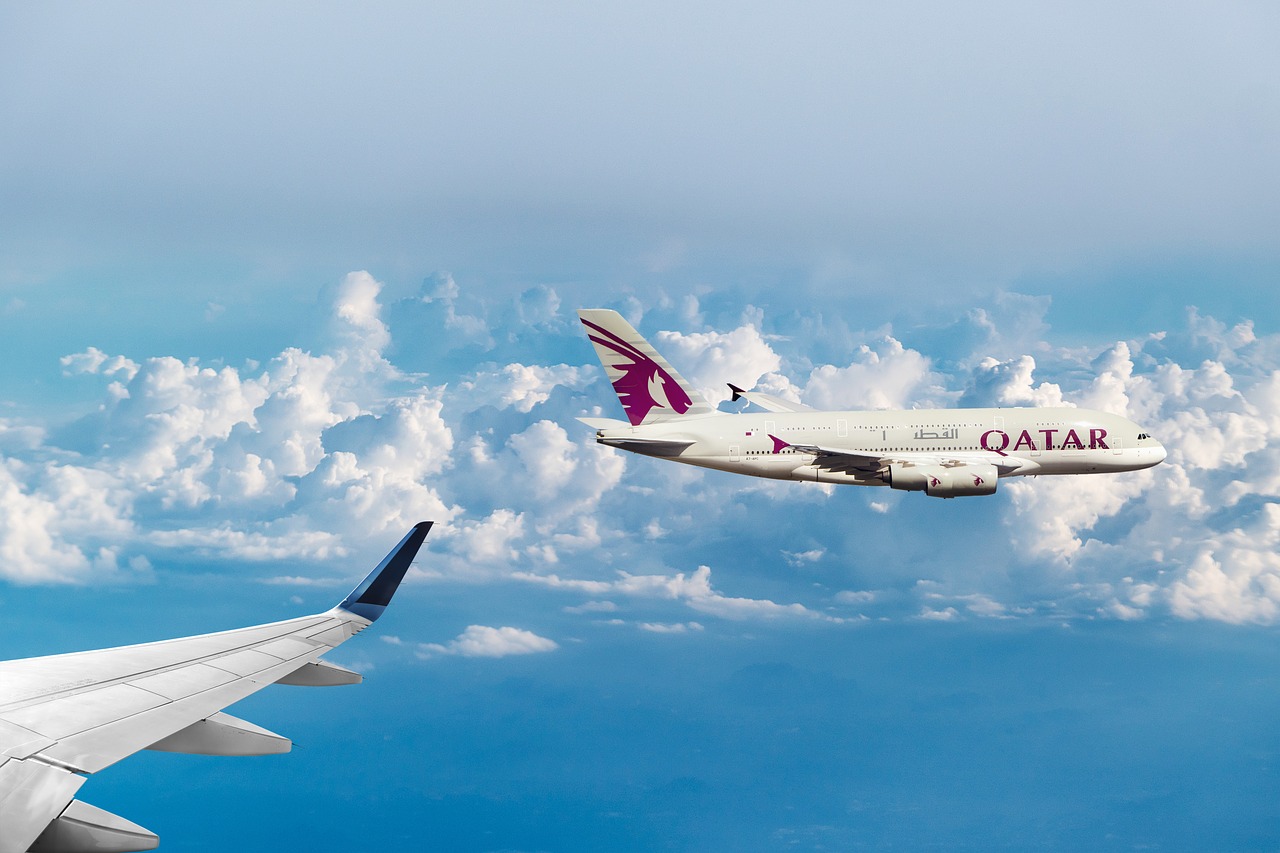 qatar airways  clouds  flying free photo