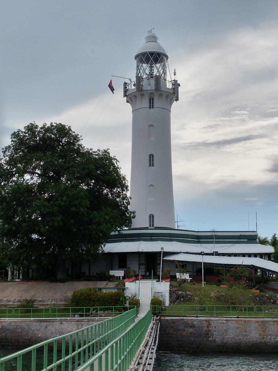 raffles lighthouse bridge cloudy free photo