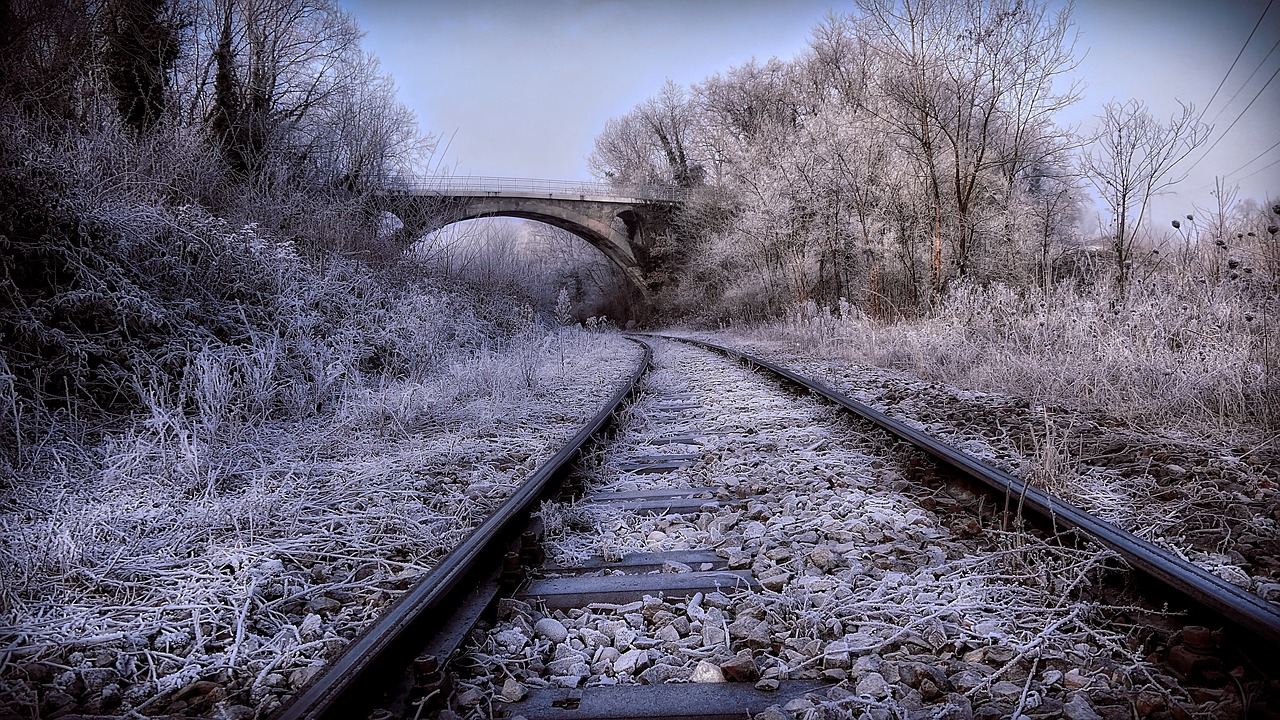 railroad tracks wintry arch bridge free photo