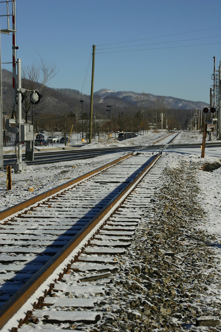 railroad tracks snow small town free photo