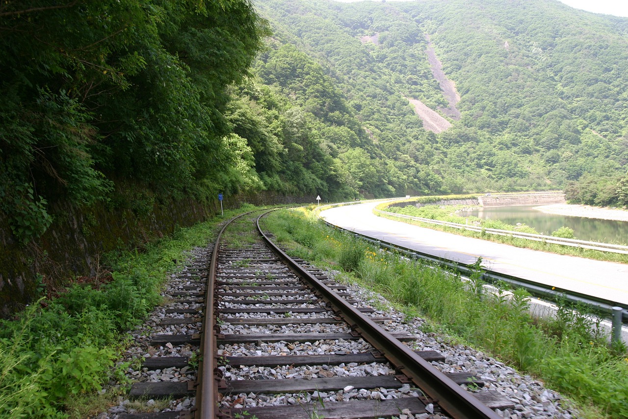 railroad tracks road landscape free photo