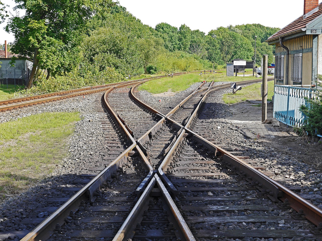 railway track crossing normal track free photo