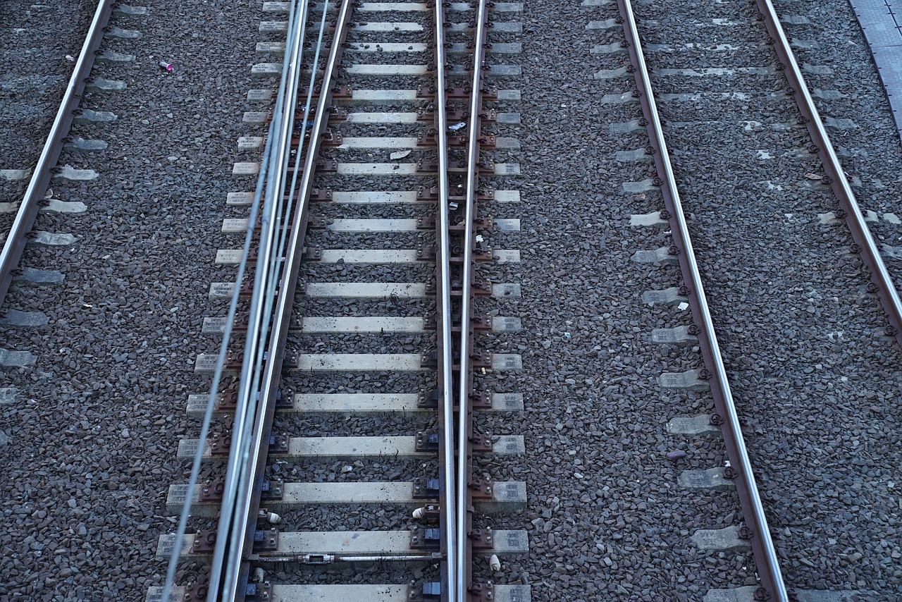 railway tracks changing lanes parting ways free photo