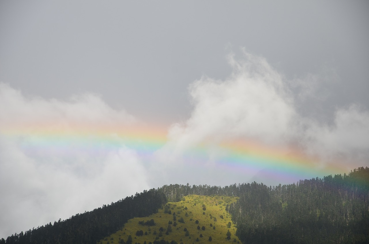 rainbow mountain cloudy day free photo