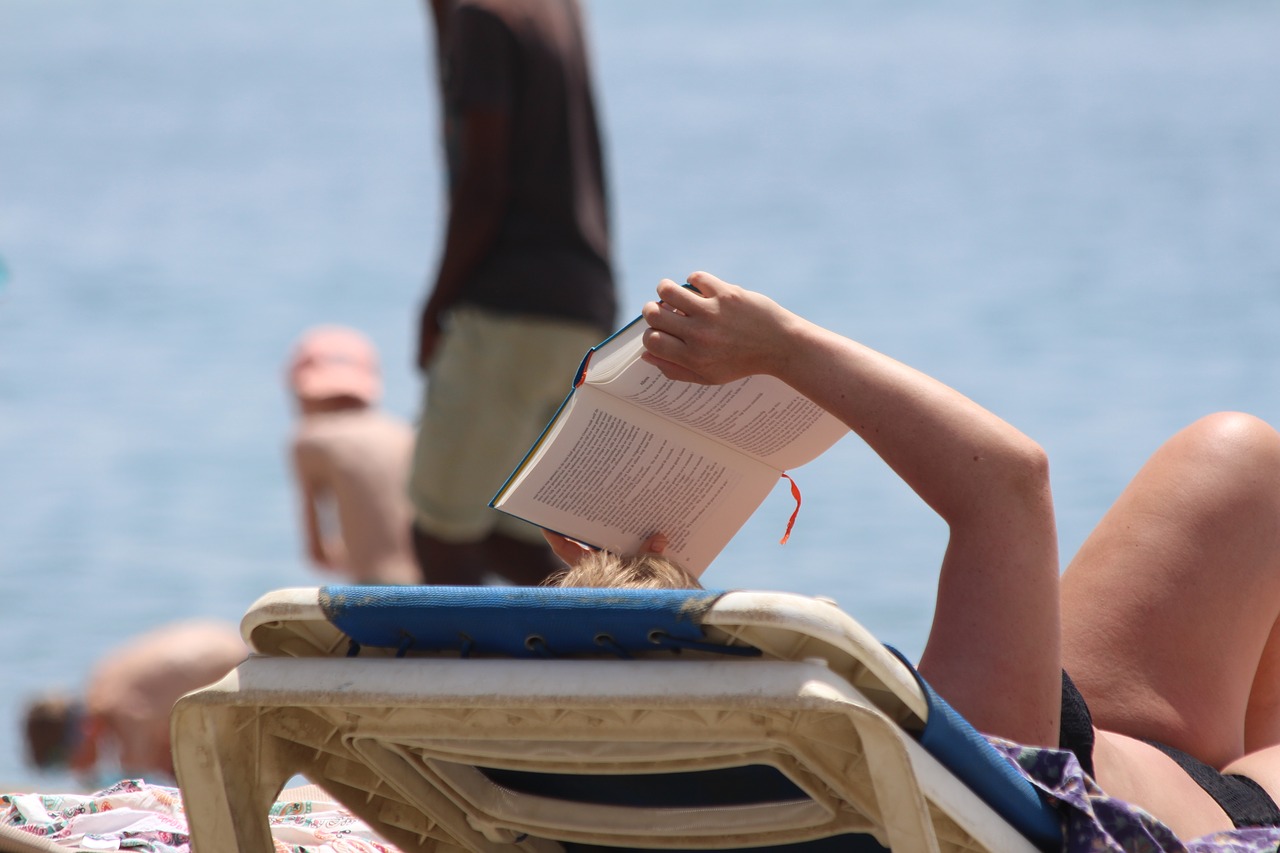 reading  beach  cultures free photo