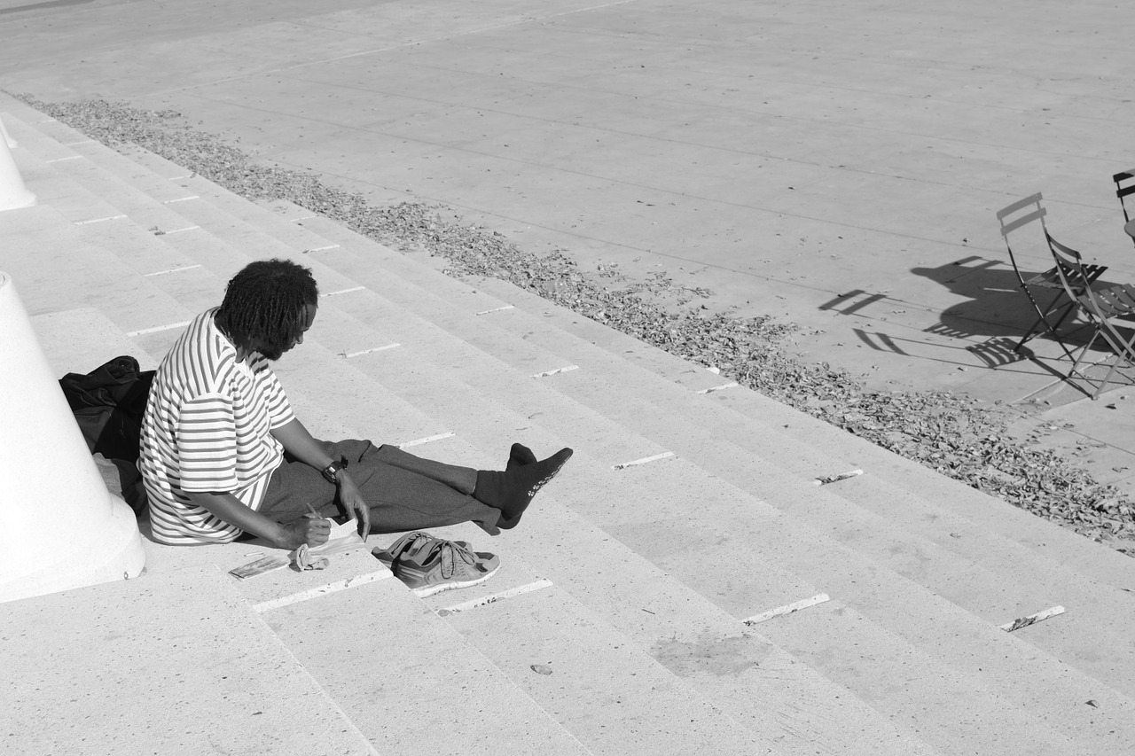 without a home old man reading a book free photo