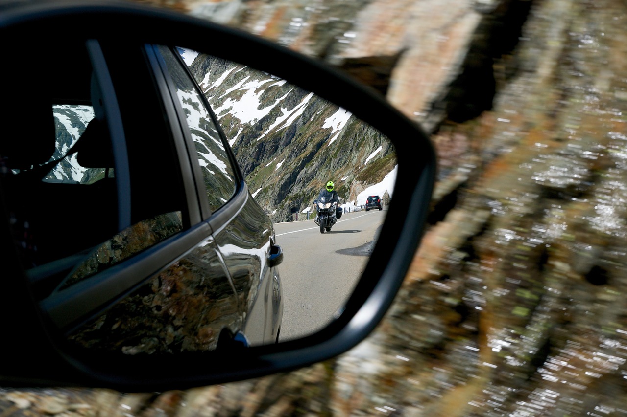 rear mirror tracker motorcyclist free photo