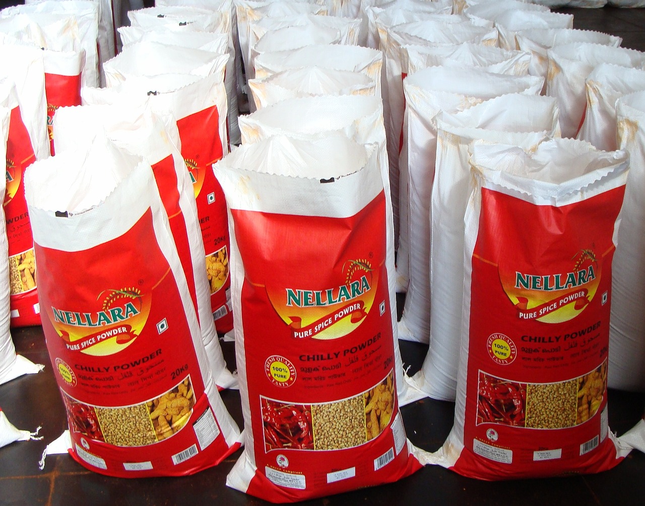 red chilli powder wholesale market bagging free photo