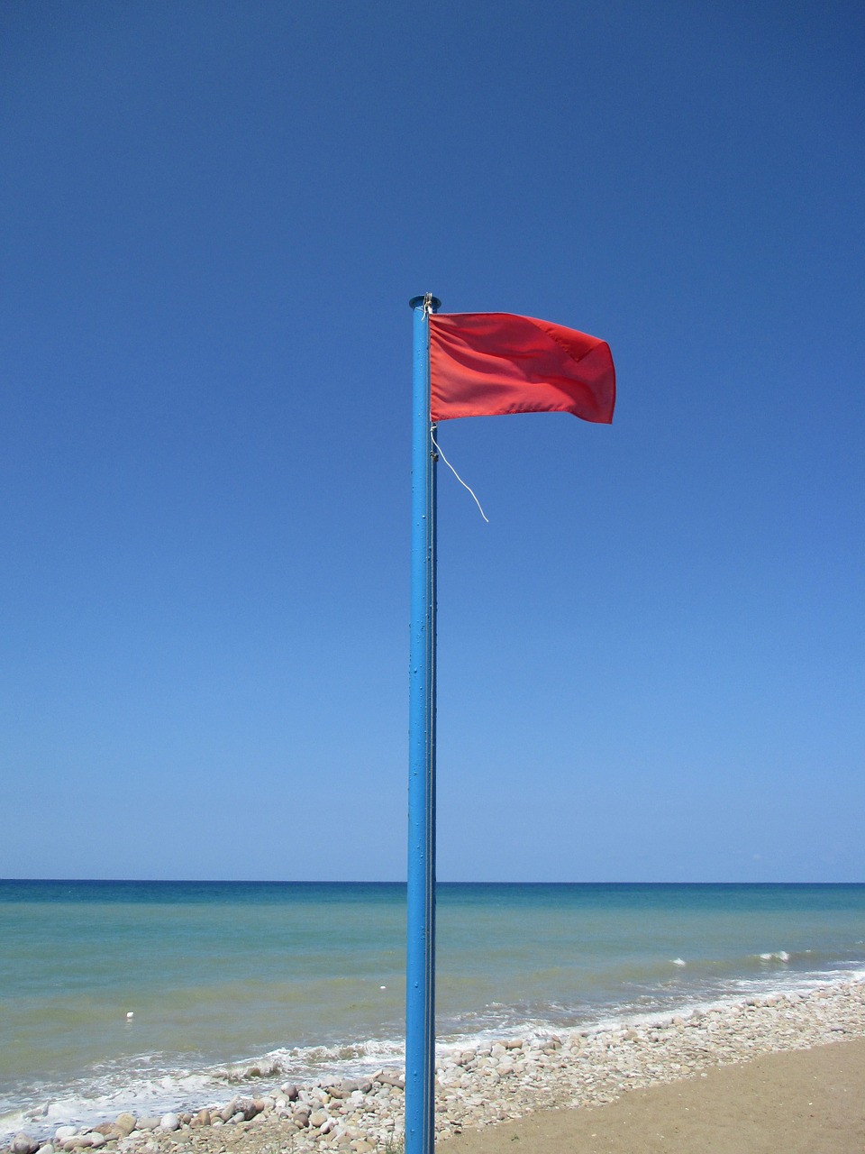 red flag sea beach free photo