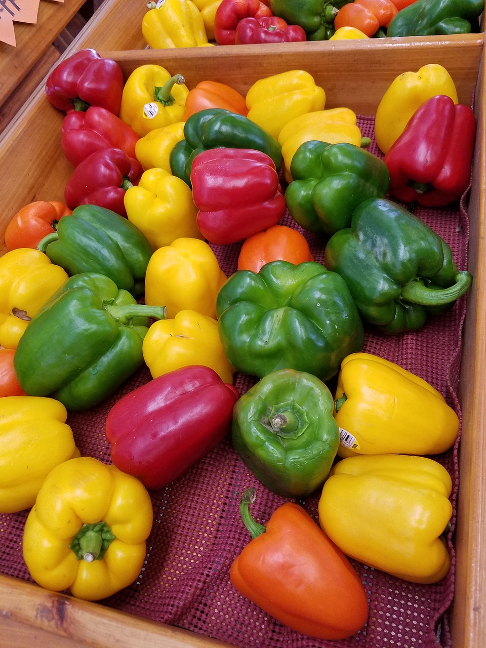 red peppers green peppers yellow peppers free photo
