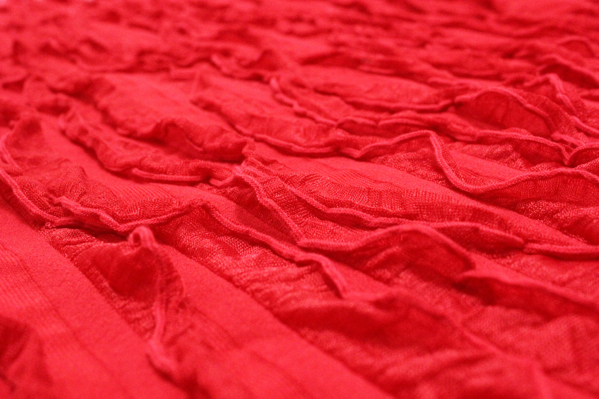 red textile background curly red background free photo