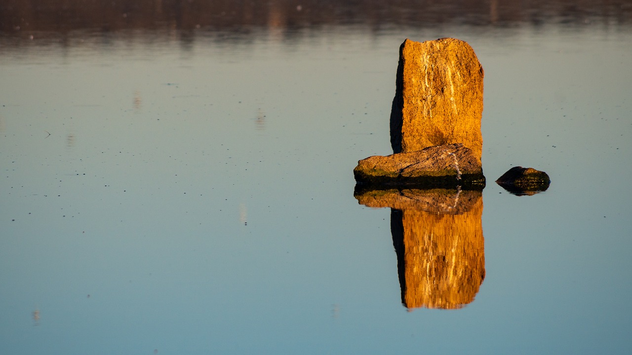 reflection  water  stones free photo