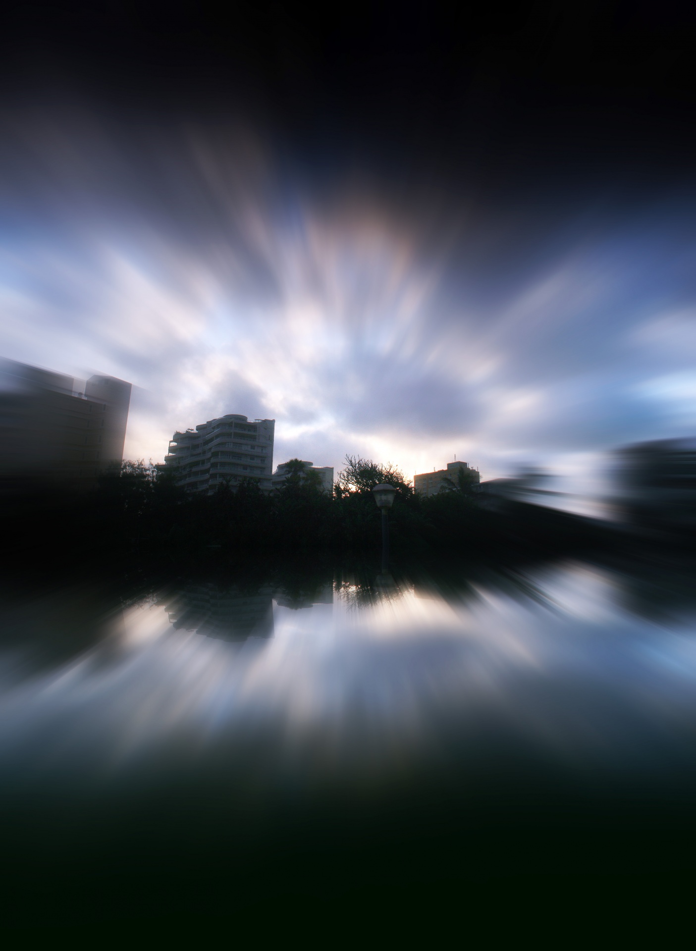 shoreline buildings clouds reflection free photo