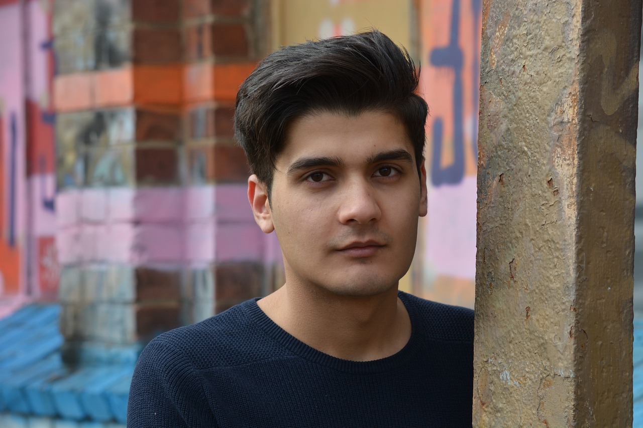 refugee young man portrait free photo