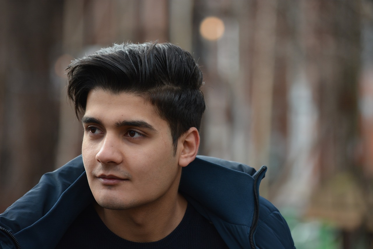 refugee young man portrait free photo