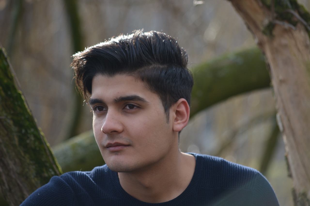 refugee young man portrait free photo