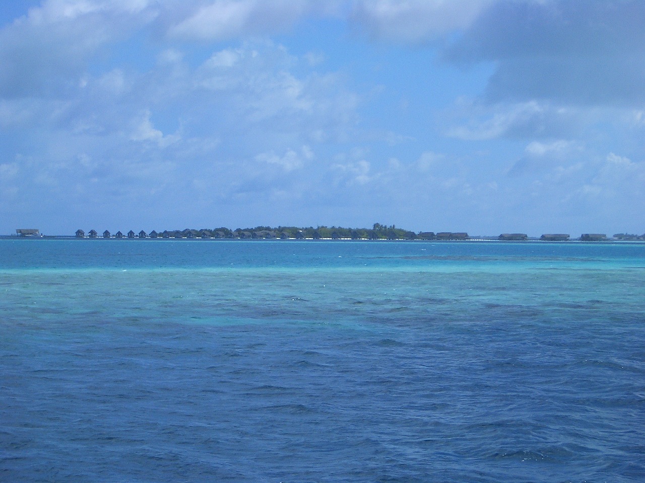 resort blue sea clouds free photo