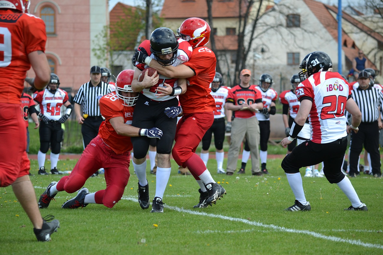 rival stopping american football free photo