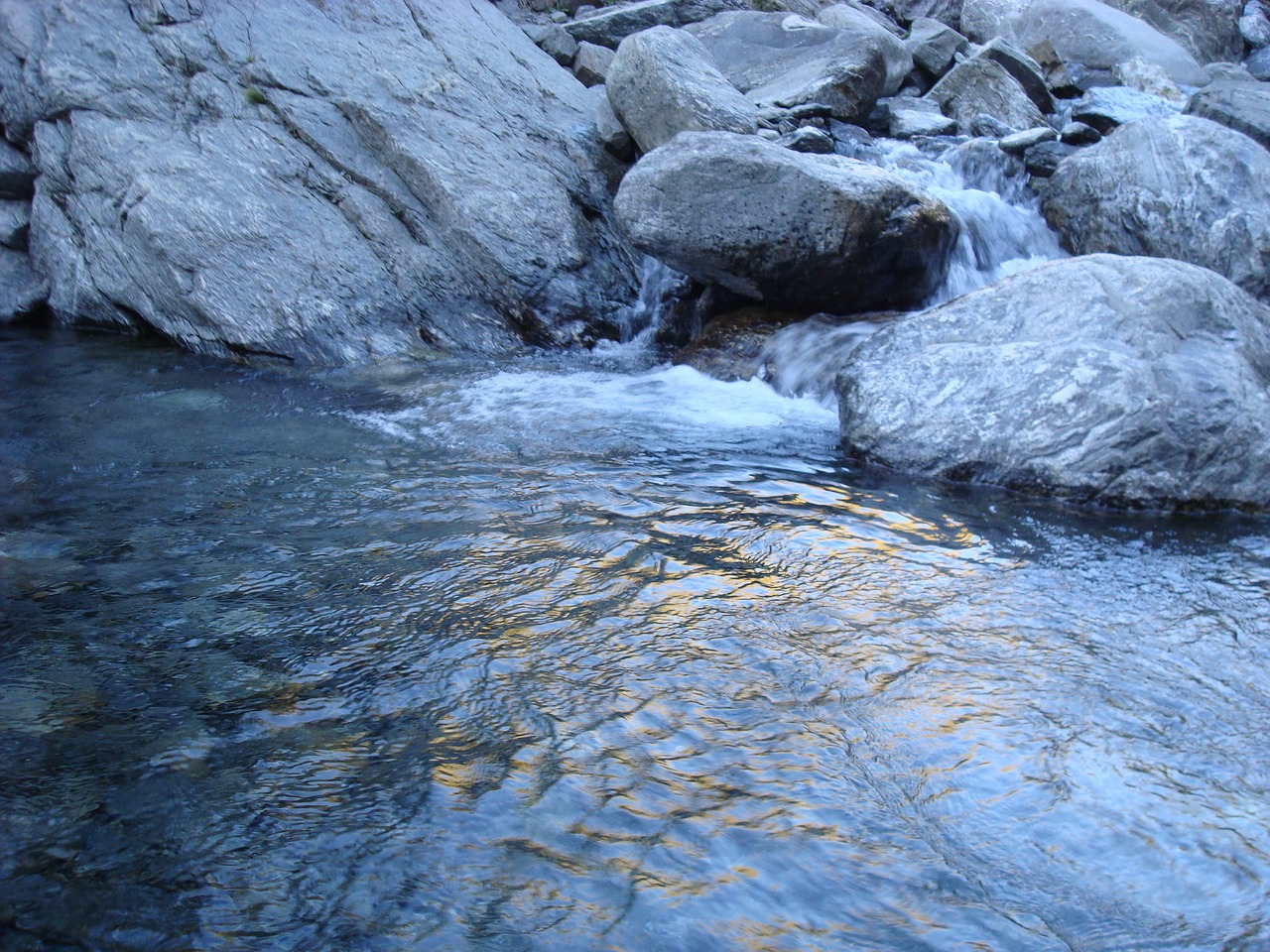 river stones shore free photo