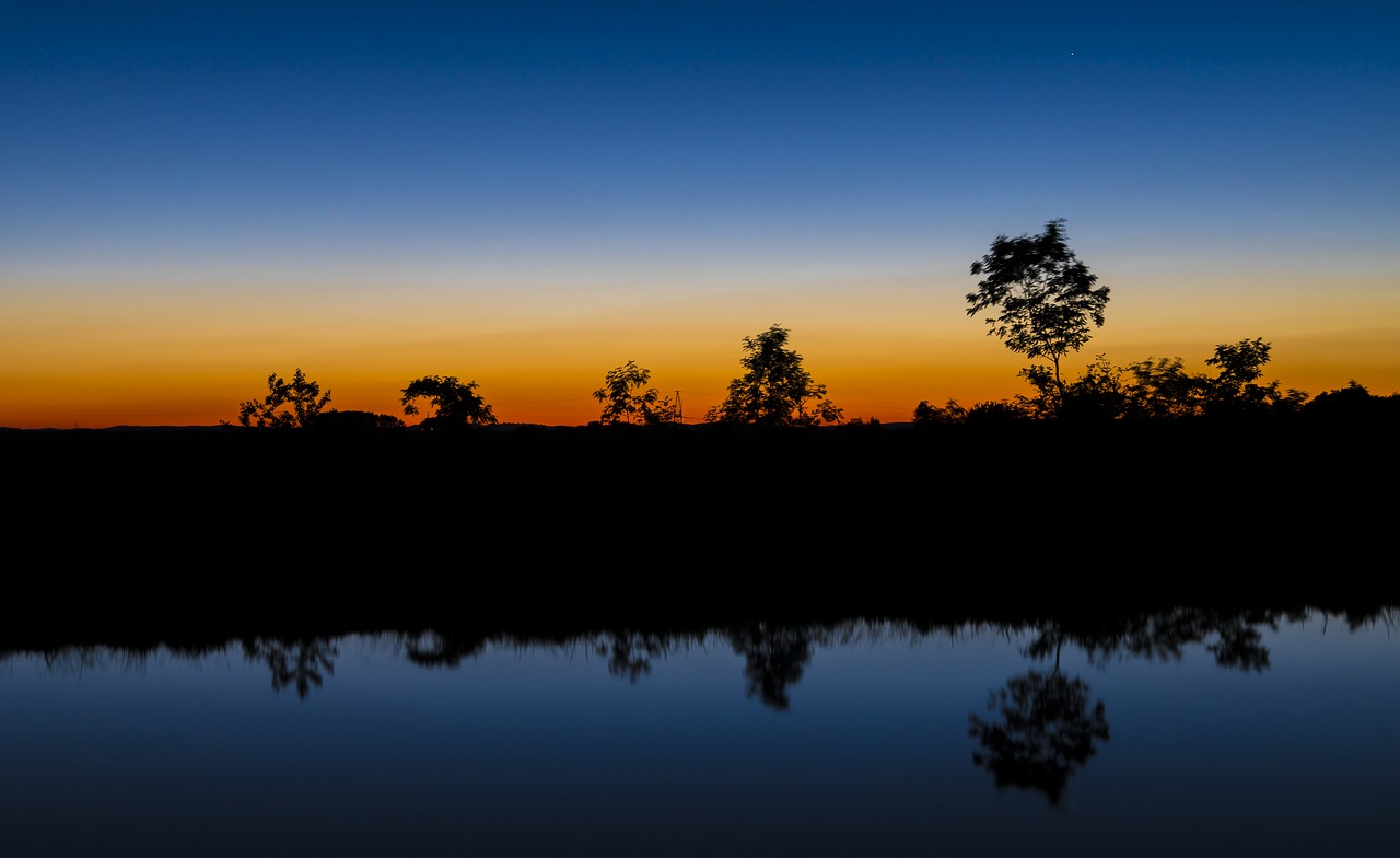 river mirroring water free photo