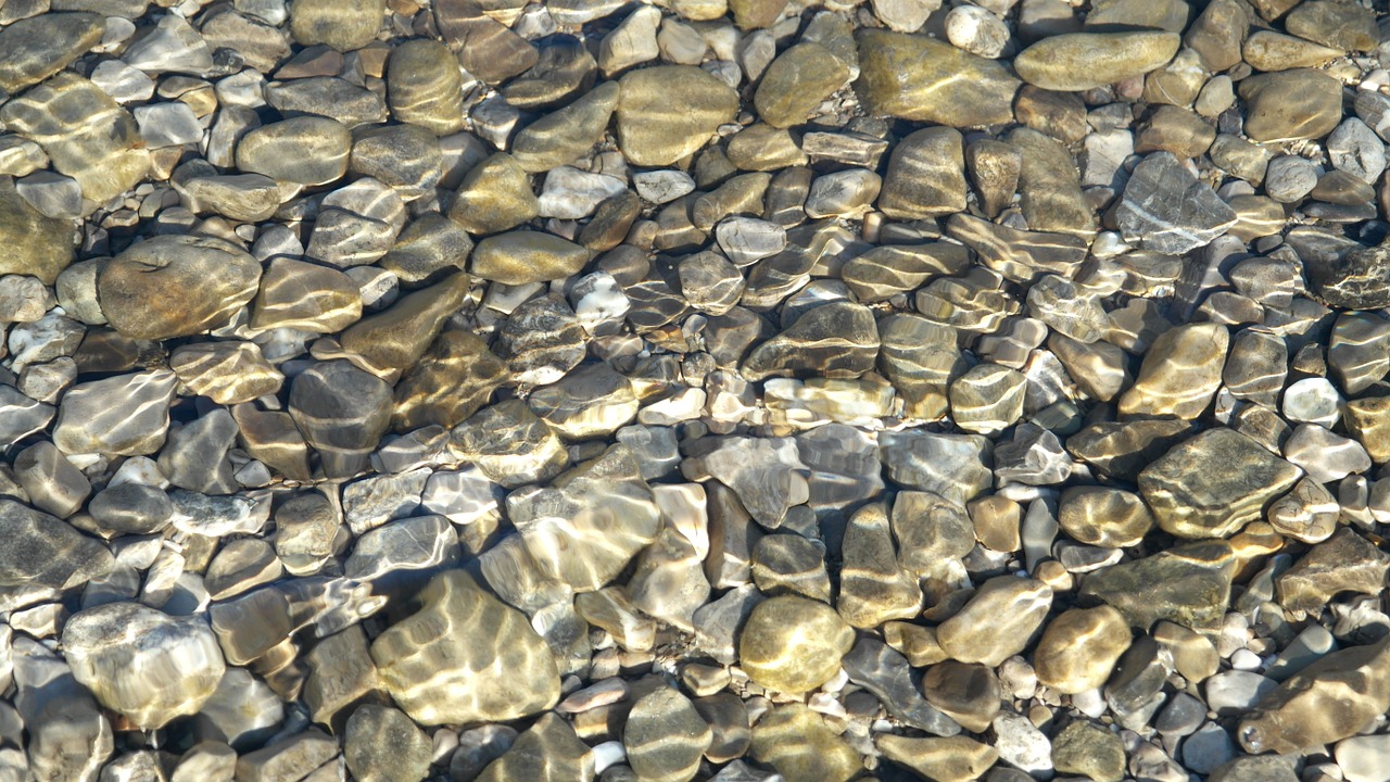 riverbed pebbles wave free photo