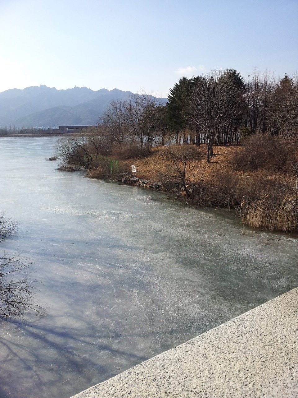 riverside river landscape the frozen lake free photo