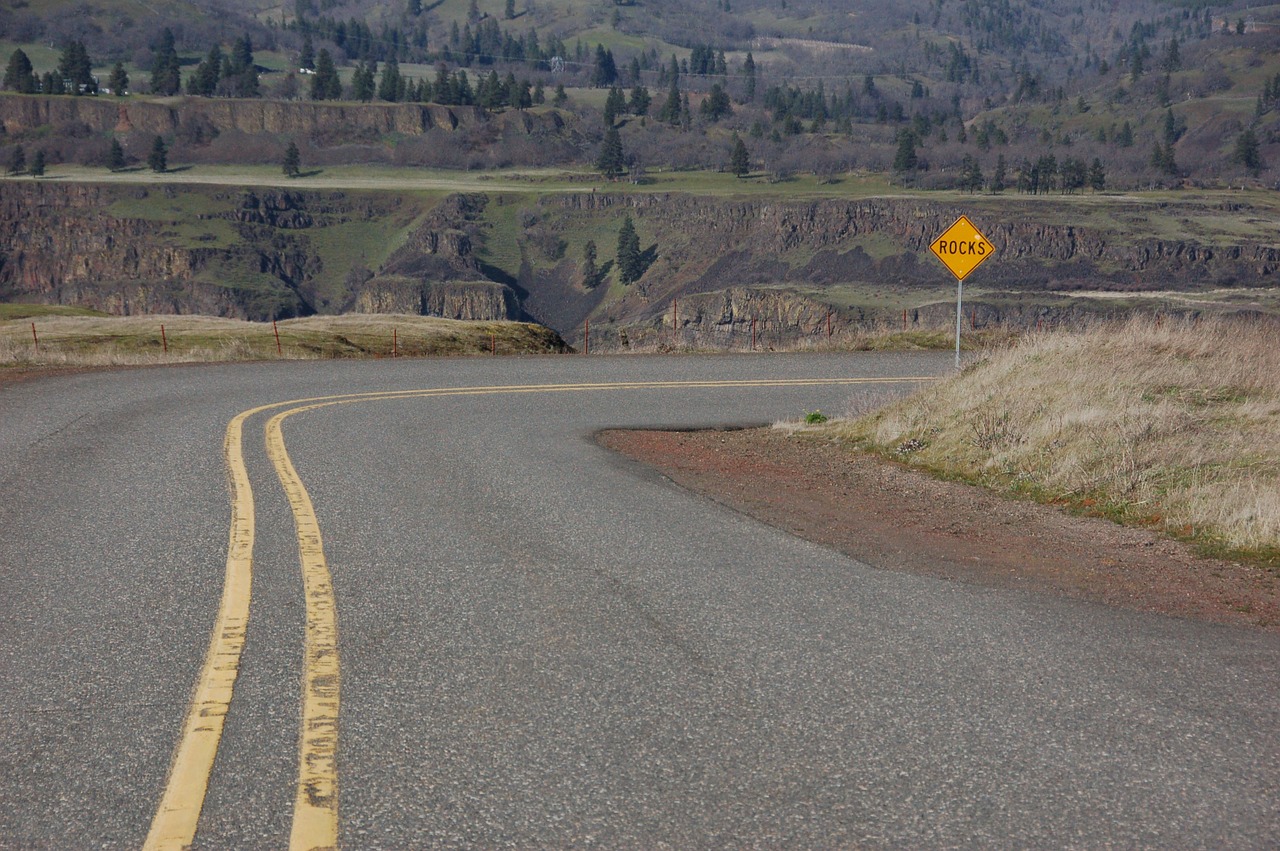 road yellow lines rocks free photo