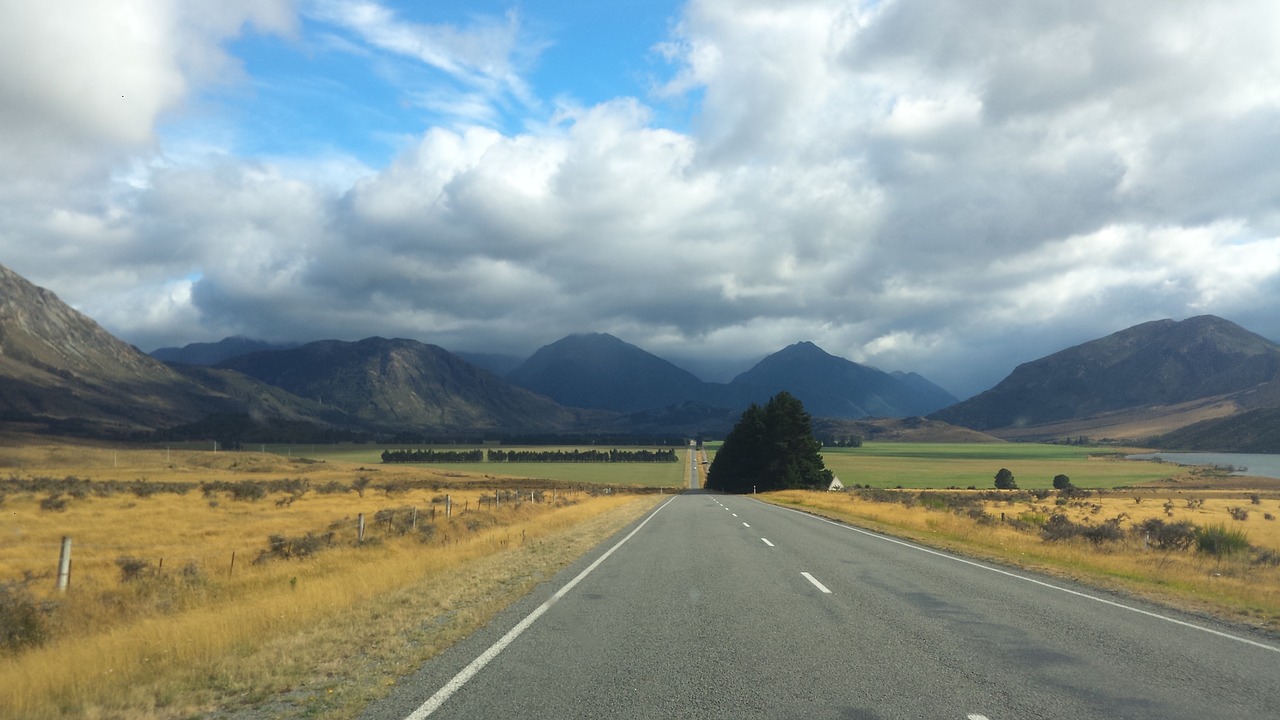 road new zealand mountain cloud free photo