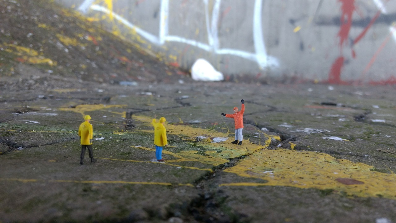 road construction  graffiti  miniature figures free photo