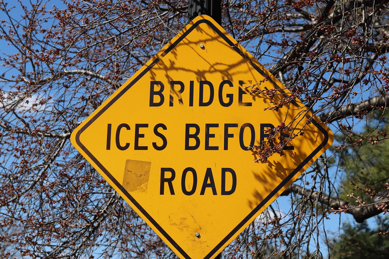 road sign  yellow sing  bridge ices free photo