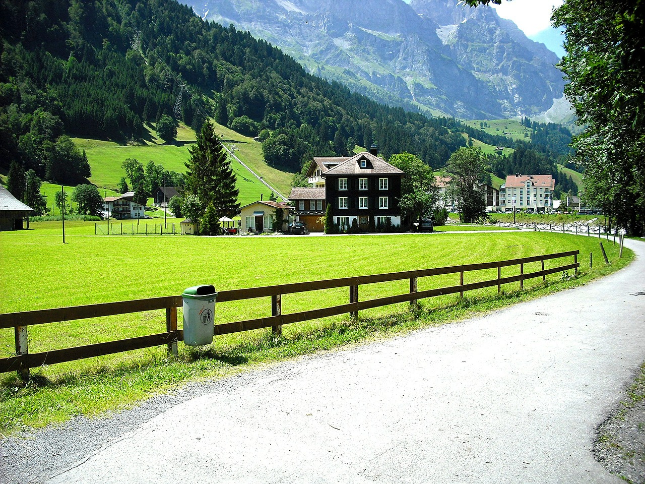 road through village house in mountains swiss free photo