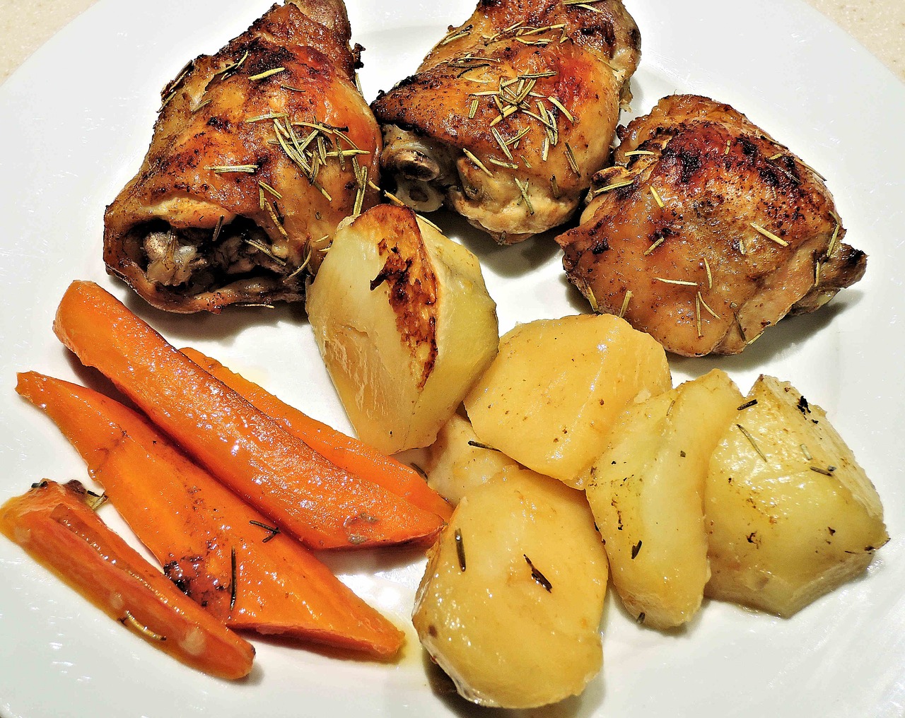 roasted chicken thighs potatoes carrots free photo