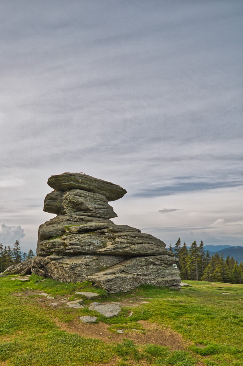 rock  devil stone  clouds free photo