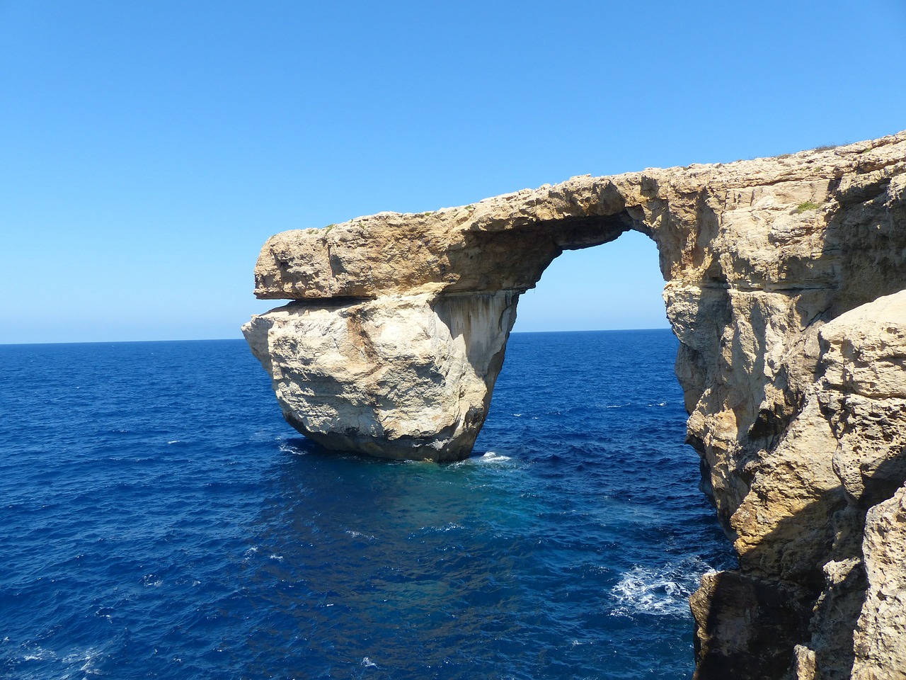 rock cliff blue window free photo